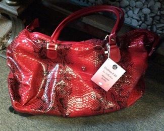 $35.00 Gorgeous new red tote on wheels  