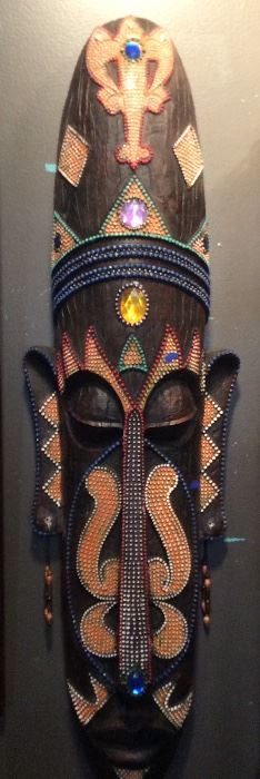 $40.00  wooden beaded wall hanging mask.  38"