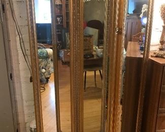 $185.00 Full size tri-folding, bi-directional dressing mirror in gilt gesso frame. Each section is 16” x 70” .  Really great bedroom mirror!   