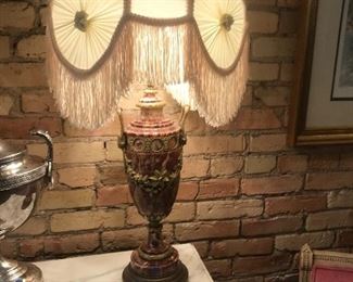 $450.00 Pair of antique French rouge marble urn shaped table lamps with floral and garland gilt ormolu, circa 1920s, extensive damage and repairs to one .