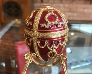 $125.00 Fabrege style egg with original box.  Open it up and find a flower with a necklace in it.  This one is called Rosebud. 