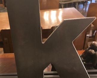 $15.00 Stylized "K" in metal  