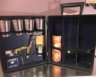 $25.00  Happy Hour travel bar with barware, playing cards, key for the lock and room for three bottles.