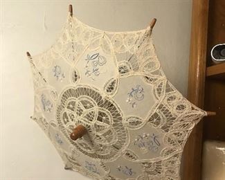$12.00 13” doll parasol with blue stitching  