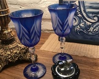 $12.00 Pair of cut glass wine glasses                                
                                                                                                                 $18.00 Viking blue table lighter 