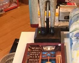 $15.00 2 drawer white metal file cabinet with file folders.  $25.00 Wooden Whirly gig Sailor 10.00 Arts and Crafts Movement Coffee Table Book