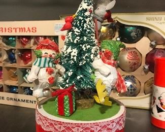 $20  Made in Taiwan musical Christmas tree with paper Mache snowman.  Works.  Really cute.
