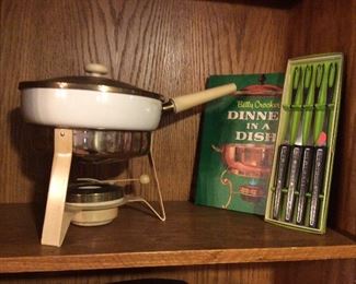 $25.00 Ceramic chafing dish trimmed in brass.  $10.00 "Betty Crocker Dinner In A Dish" cookbook.  $8.00 Cordova fondue forks, new in box. 