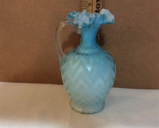 $25.00  cased glass ruffled top pitcher with chevron pattern.  Applied reeded handle.  No marks.  See damage on bottom,of handle.  AS IS 
