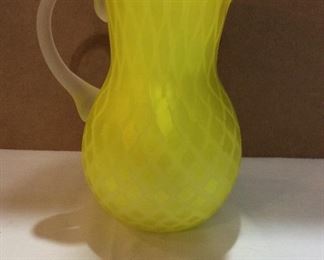 $48.00  9” yellow cased glass pitcher with applied reeded handle and diamond pattern.
