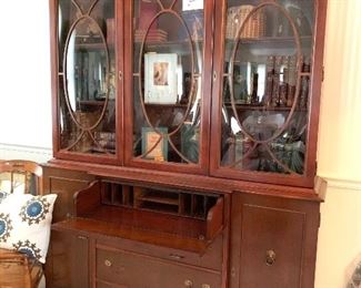 Stunning, Mahogany Bookcase, drawer opens up to become a desk.  Oval Bubbled glass doors were very expensive to make.  This is a special piece.  It can also be used as a China Cabinet   $898.00