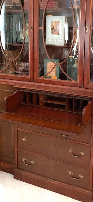 Stunning, Mahogany Bookcase, drawer opens up to become a desk.  Oval Bubbled glass doors were very expensive to make.  This is a special piece.  It can also be used as a China Cabinet $898.00