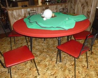 This is a large round vintage formica top table that was covered with felt. See the next photo for the table-top.