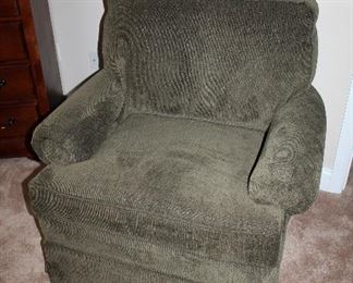 Comfy green upholstered swivel chair