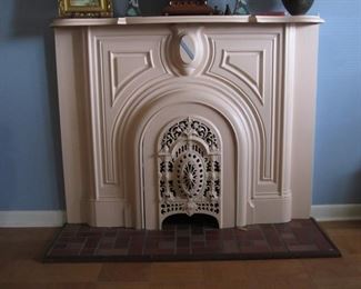 Antique cast iron fireplace surround and cover.