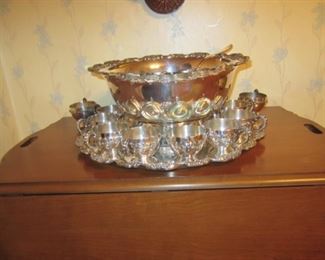 Silver punch bowl with 14 cups.