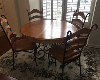 Wood and iron kitchen table (with one leaf) & 4 chairs; area rug