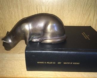 Side view of bronze cat