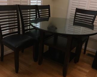 Kitchen table and 4 chairs with shelving under table