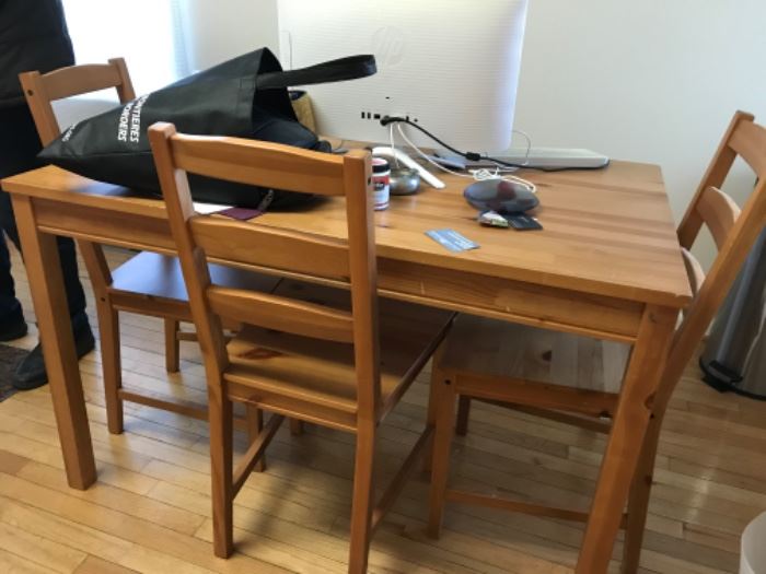 IKEA table with 4 chairs measures 46.5”x29” 