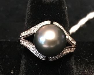 14k gold Black pearl ring surrounded by diamonds. Size 6.5. Total weight 6.7g. $750,