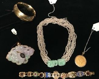 14k gold hollow hinged bangle9.8g $1,400.; antique white carved jade medallion in 14k bezel $425; 4 pearl choker with interlocking carved jade clasp SOLD; 14k ten charm slide bracelet $4,500; 1879 20 dollar gold piece SOLD.
