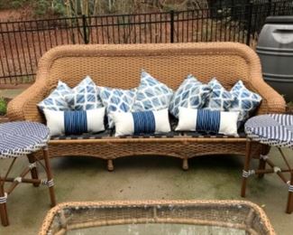 Assorted outdoor pillows and side tables