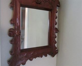 Pair of antique carved wood opposing mirrors