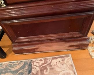 damage on the bottom of grandfather clock