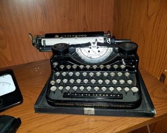 selection of vintage/antique cameras, telephones and typewriters