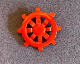 $45 Bakelite Red "Wheel" Pin.  Approx 2 in. diameter.