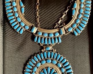 $1,150 Sterling and turquoise Navajo Sun Wheel necklace. "SWM Sterling" mark on reverse.