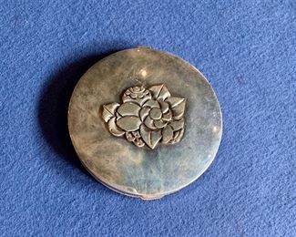 $185 Sterling Silver Compact with intact mirror.  Stamped "hand made", "sterling" and "KE" inside case.  3.5 in diameter.