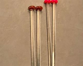 $12 4 glass swizzle sticks, two brown and two red heads 5” long 