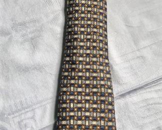 $60 Hermès blue, taupe and tan patterned tie 