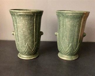 $40 pair of green mottled urns with small scroll ornament (one urn has kiln mark on lip) 8”H x 5”D