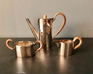 $195 Modernist three piece silver-plate tea set with rattan handles and wood top