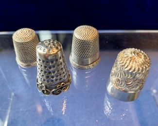 $12 Lot if 4 sterling thimbles Total weight 18.52
