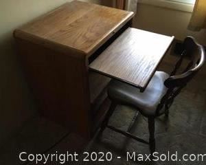 Small oak computer desk with pullouts and pine chair. 