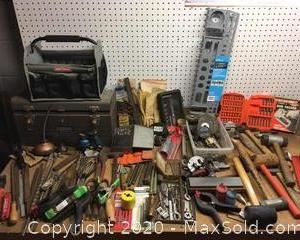 A large assortment of tools. Many drill bits, wrenches, hammers, tool carry case, tool box 