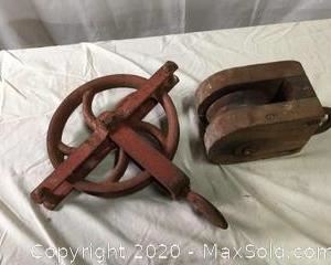 Vintage metal pulley by Western Block. Wooden pulley, manufacturer unknown.