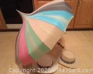 A unique vintage umbrella and two hats