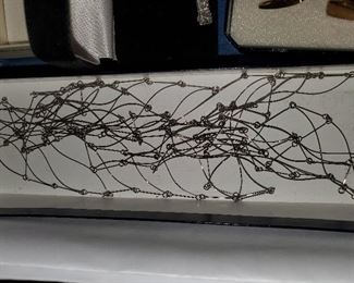 VERY UNUSUAL WEB NECKLACE WITH PAPERS