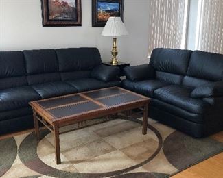 Black Sofa and Loveseat, Sofa Table, 2 Coffee Tables, End Tables, Area Rug x 2, Stiffel Lamps x 2, Art