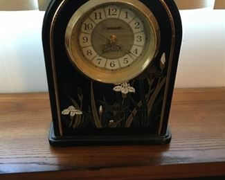 . . . a nice mantle clock in black and brass