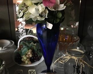 . . . an assortment of accent pieces, highlighted by the cobalt blue vase.