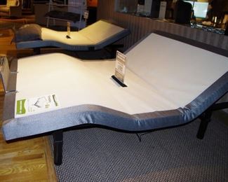 queen size new adjustable bed base with wireless remote, head, foot and massage.