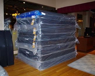 Lots of queen size foundations and coiled box springs