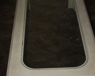 53 X 24 CREAM AND GLASS COFFEE TABLE $50
