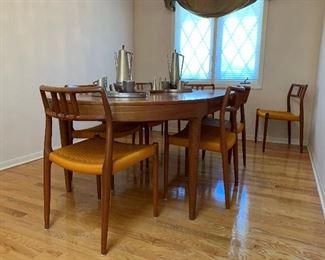 MCM Teak J.L. MOLLER Models 8 Chair Set with Original Woven Seats and MOGENS KOLD Teak Dining Room Table with Two Leaves